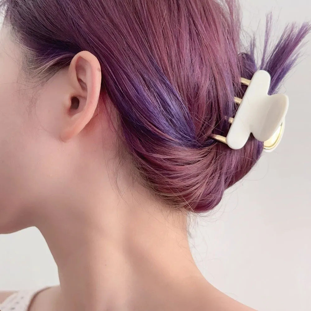 Dopamine retro acetate hair barrette with a metal grip in a medium size, shown in beige colour.
