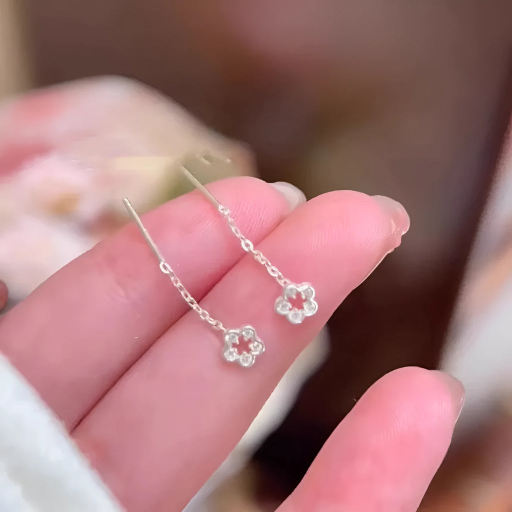 Silver colour hollow flower hanging earrings with petal design on alloy posts