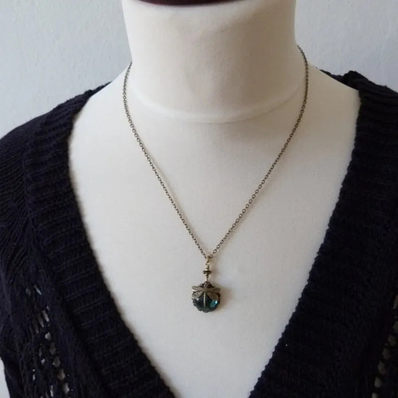 Hand carved dragonfly pendant necklace with vintage bronze appearance and 925 silver setting