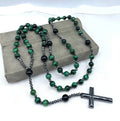 Men's hand-woven stone cross pendant necklace on a ball bead chain with safety lock clasp.