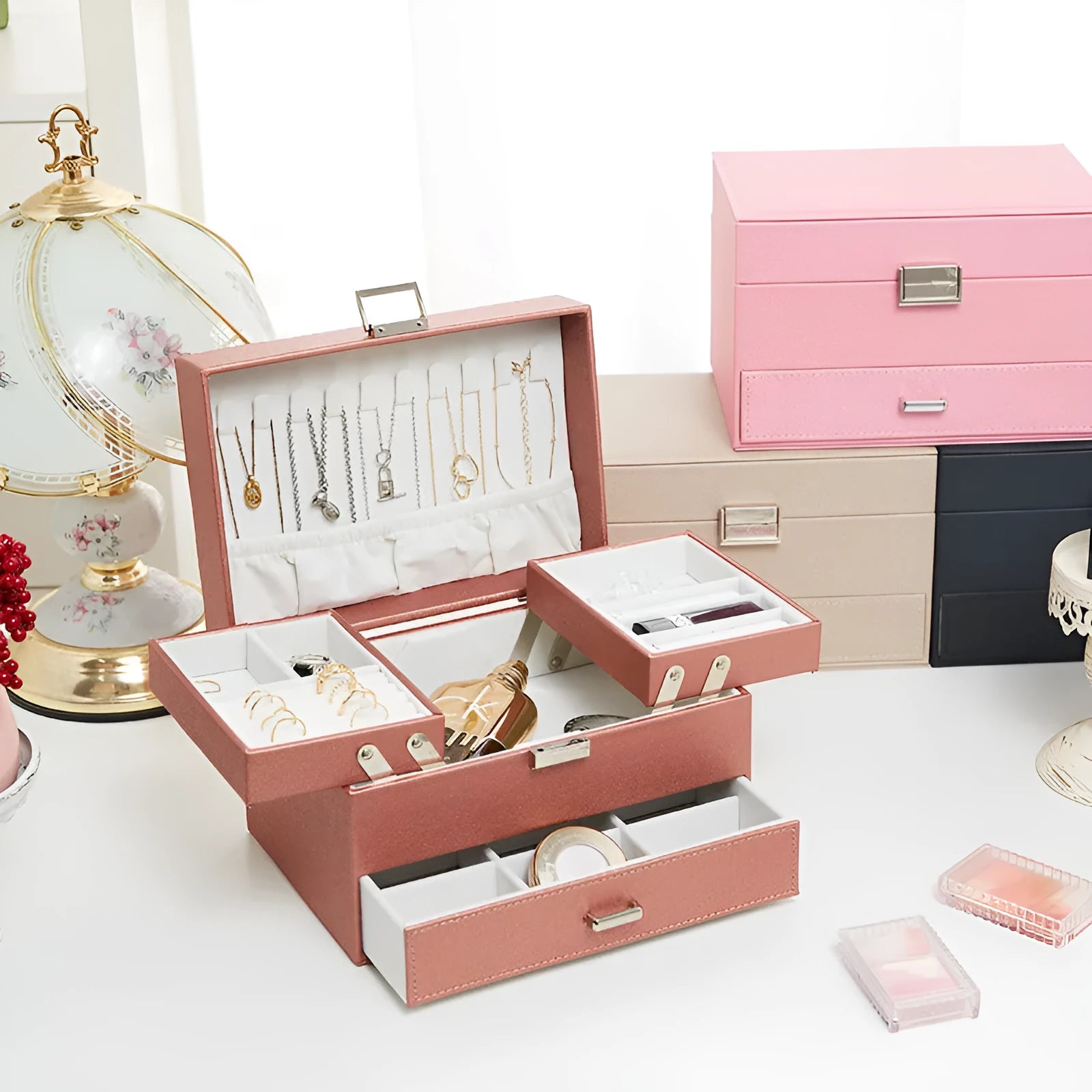 Hard leather jewellery storage box in beige, black, pink, or rose gold, showing its rectangular shape and compact size