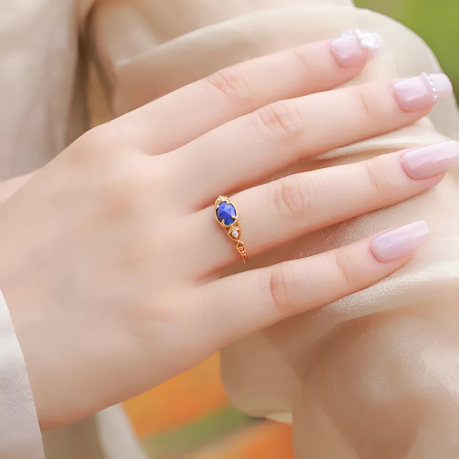 Japanese style geometric silver-tone alloy ring with a blue Lapis Lazuli ellipse stone.