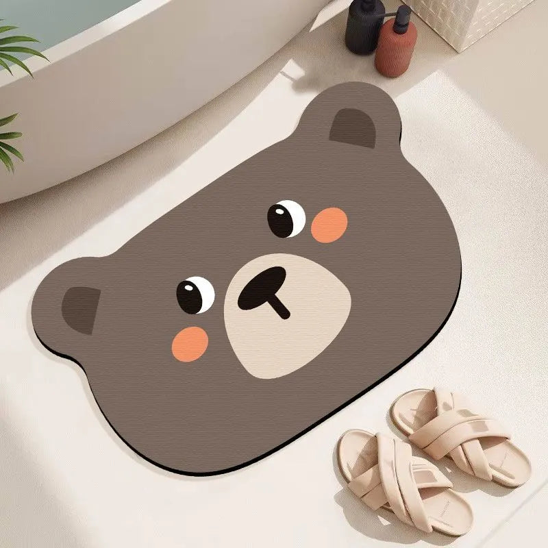 Colourful cartoon animal diatomaceous earth bathroom mat on tiles, showing non-slip base and absorbent texture.