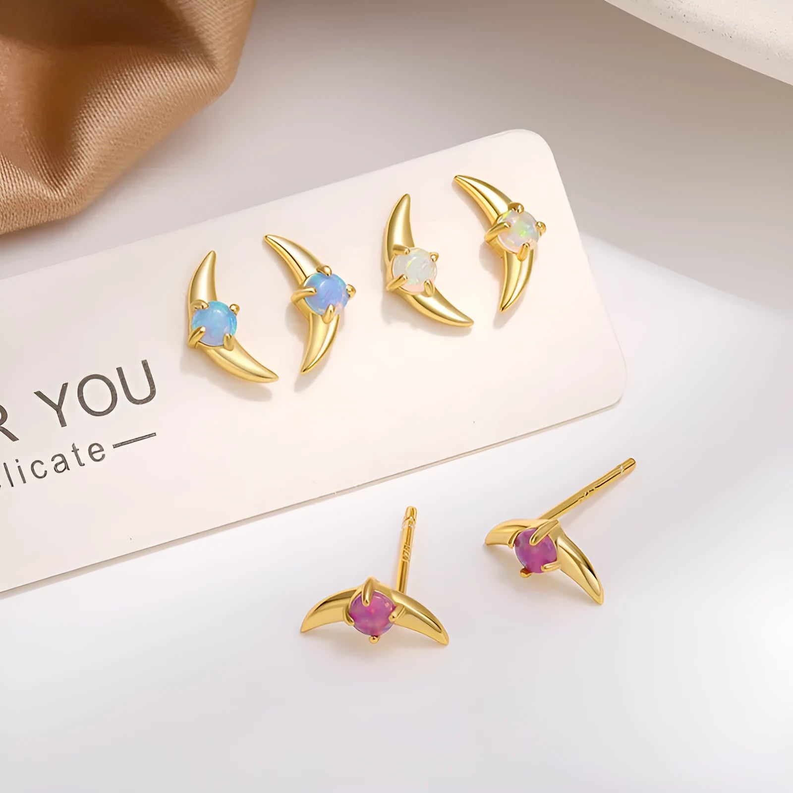 Women's geometric earrings in 925 silver with electroplated finish showing six colour variations
