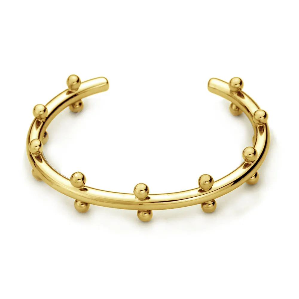 Stainless steel alloy C-shaped bracelet with textured rivet design and bean beads on an adjustable clasp.
