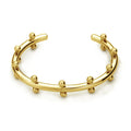 Stainless steel alloy C-shaped bracelet with textured rivet design and bean beads on an adjustable clasp.