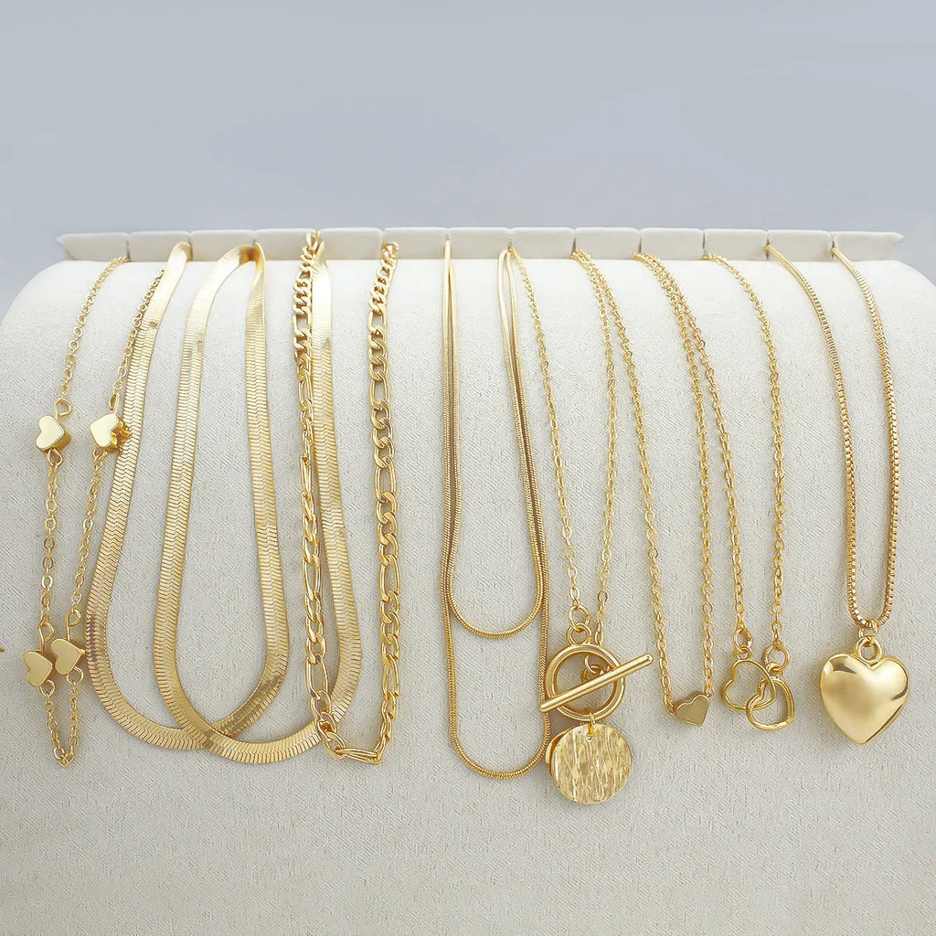 Gold women's necklace set of 10 pieces with snake bone chains and adjustable length
