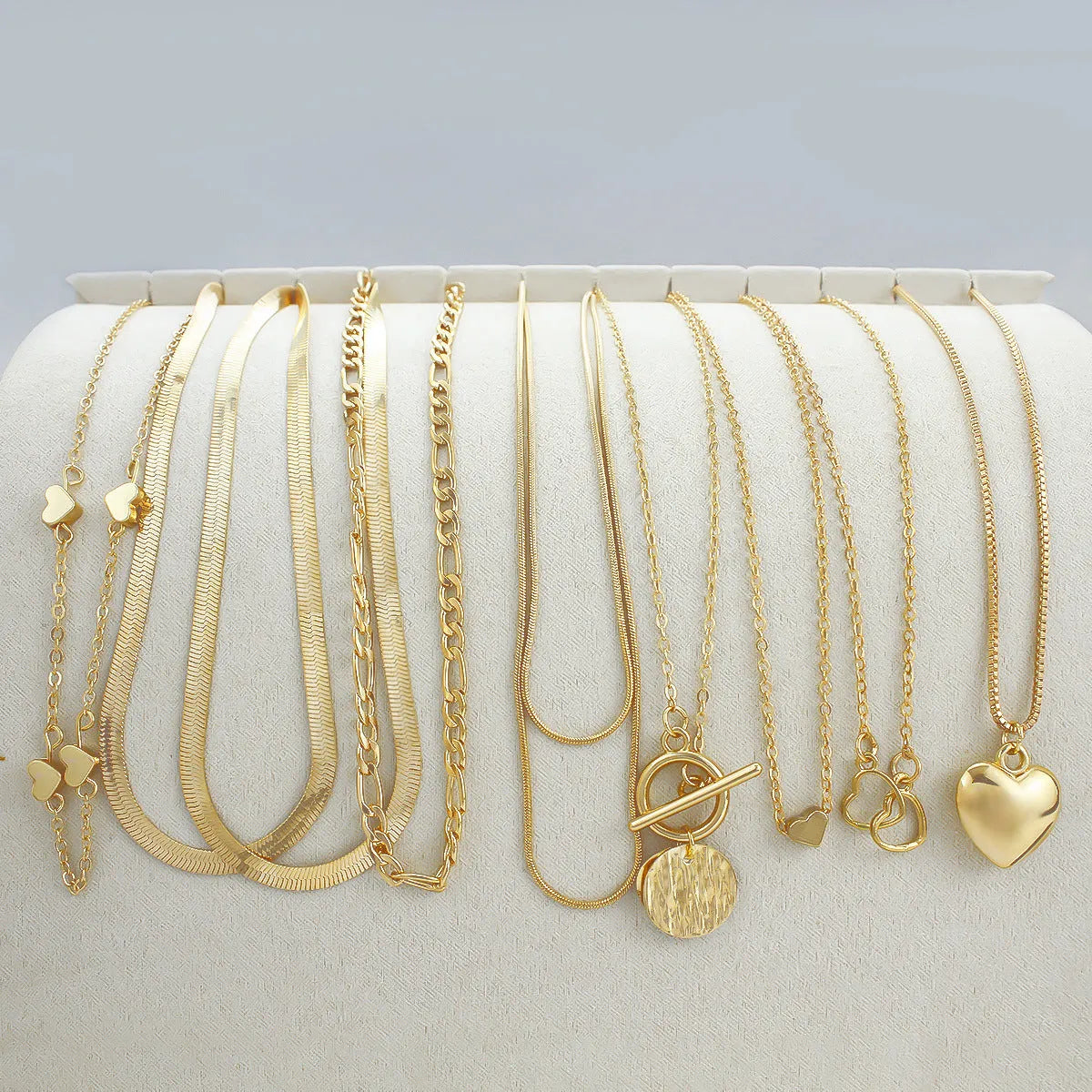 Gold women's necklace set of 10 pieces with snake bone chains and adjustable length