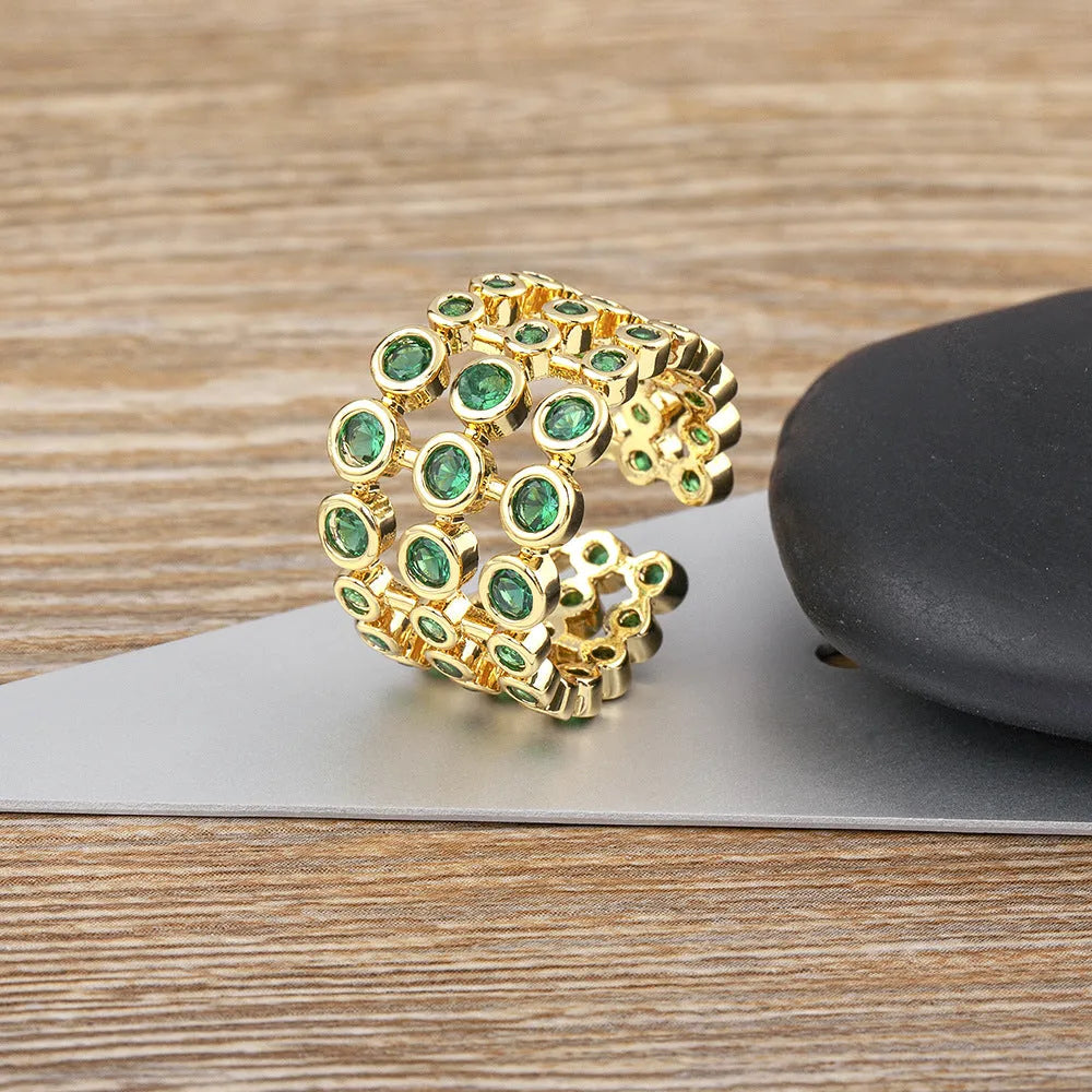 Copper ring with 18K gold plating and green zircon on exaggerated wide three-layer band