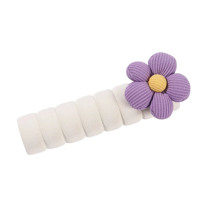 Soft round floral door handle protective cover in PEVA material on a door.