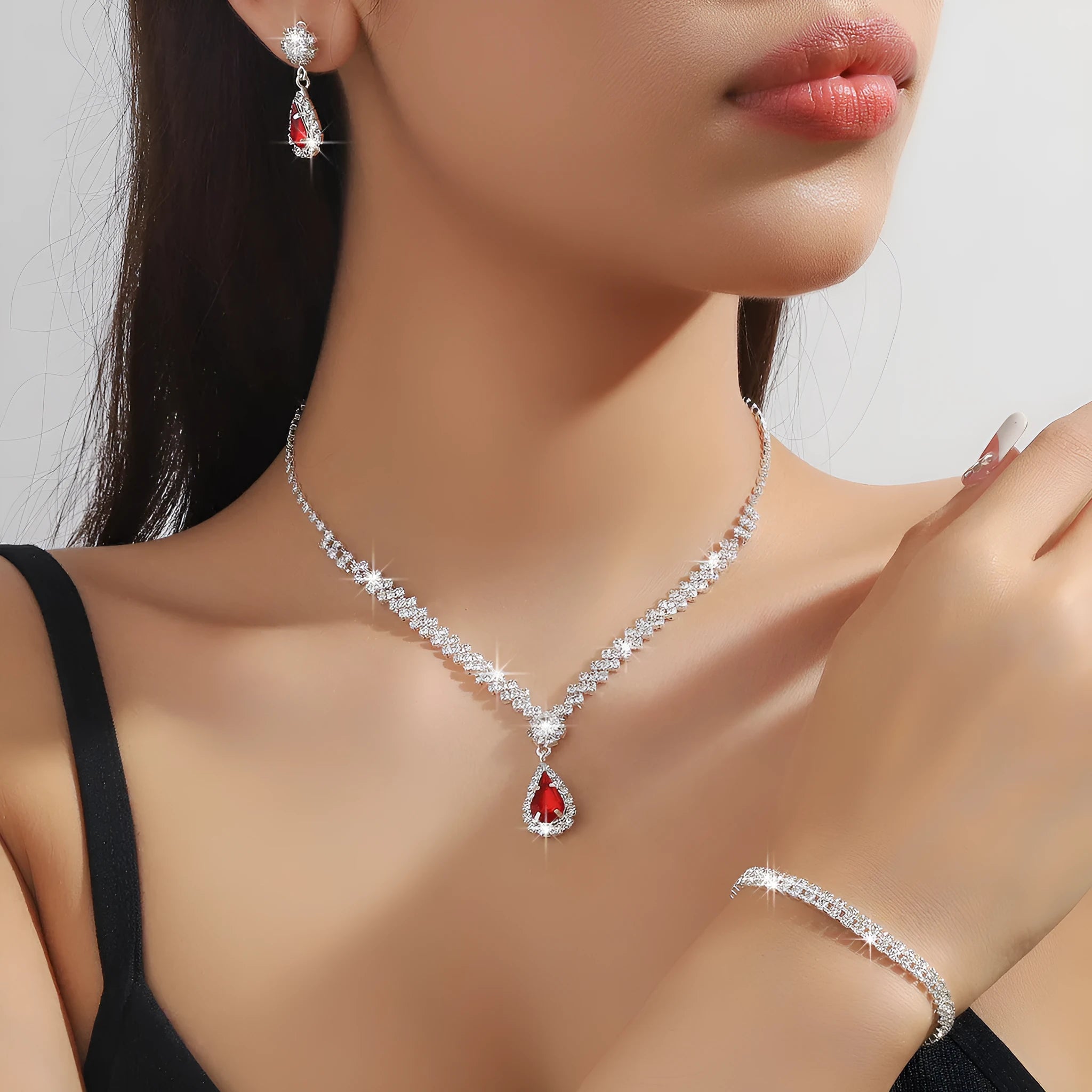 Claw chain necklace and matching earrings set with water drop rhinestone design in multiple colours