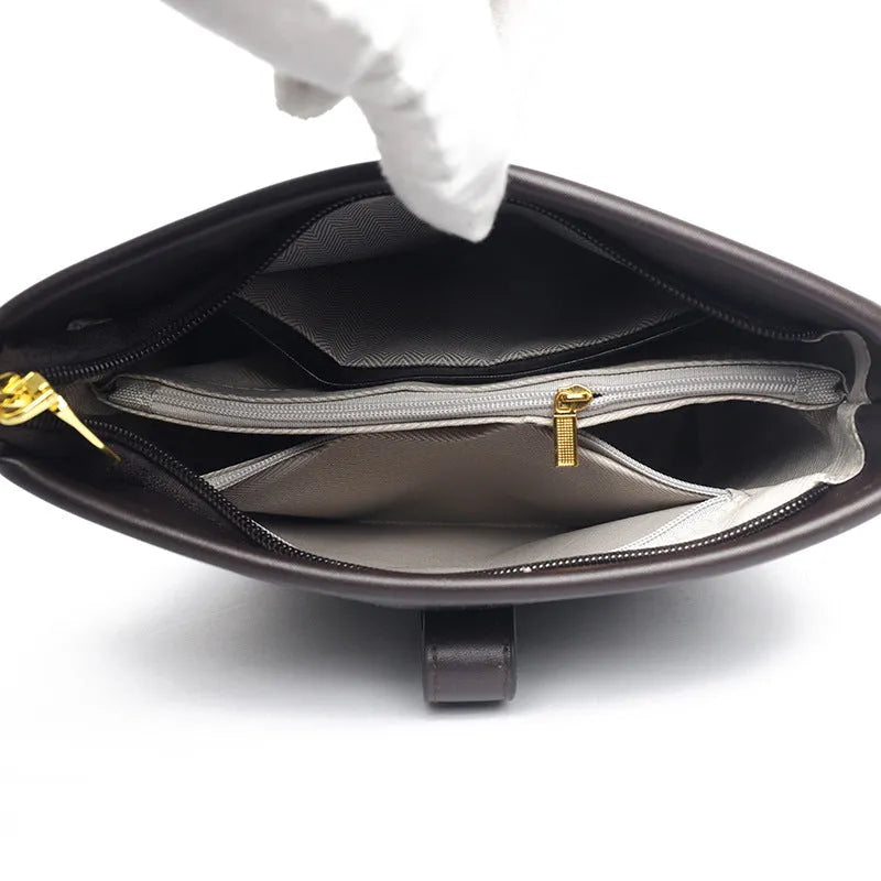 Korean style black bucket bag with dual shoulder straps and multiple internal zippered compartments