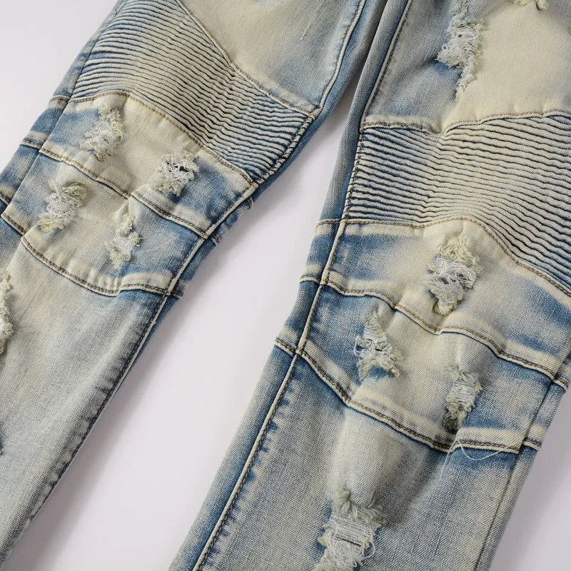 Light blue men's slim fit jeans with hand-frayed distressing and beggar-style details