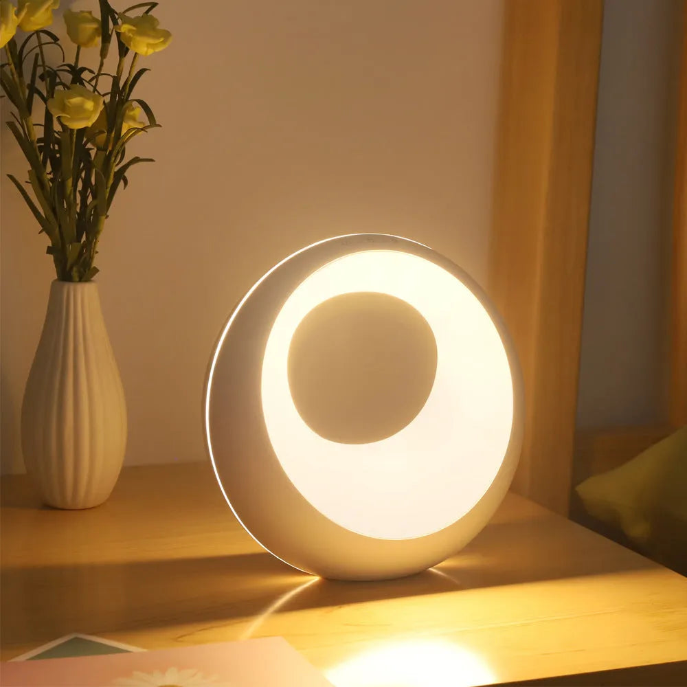 Creative Touch small white RGB colour-changing desk lamp with remote control on a wooden table.