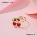 Cherry jewellery set showing necklace, bracelet, earrings, and ring with stainless steel construction and cherry motifs