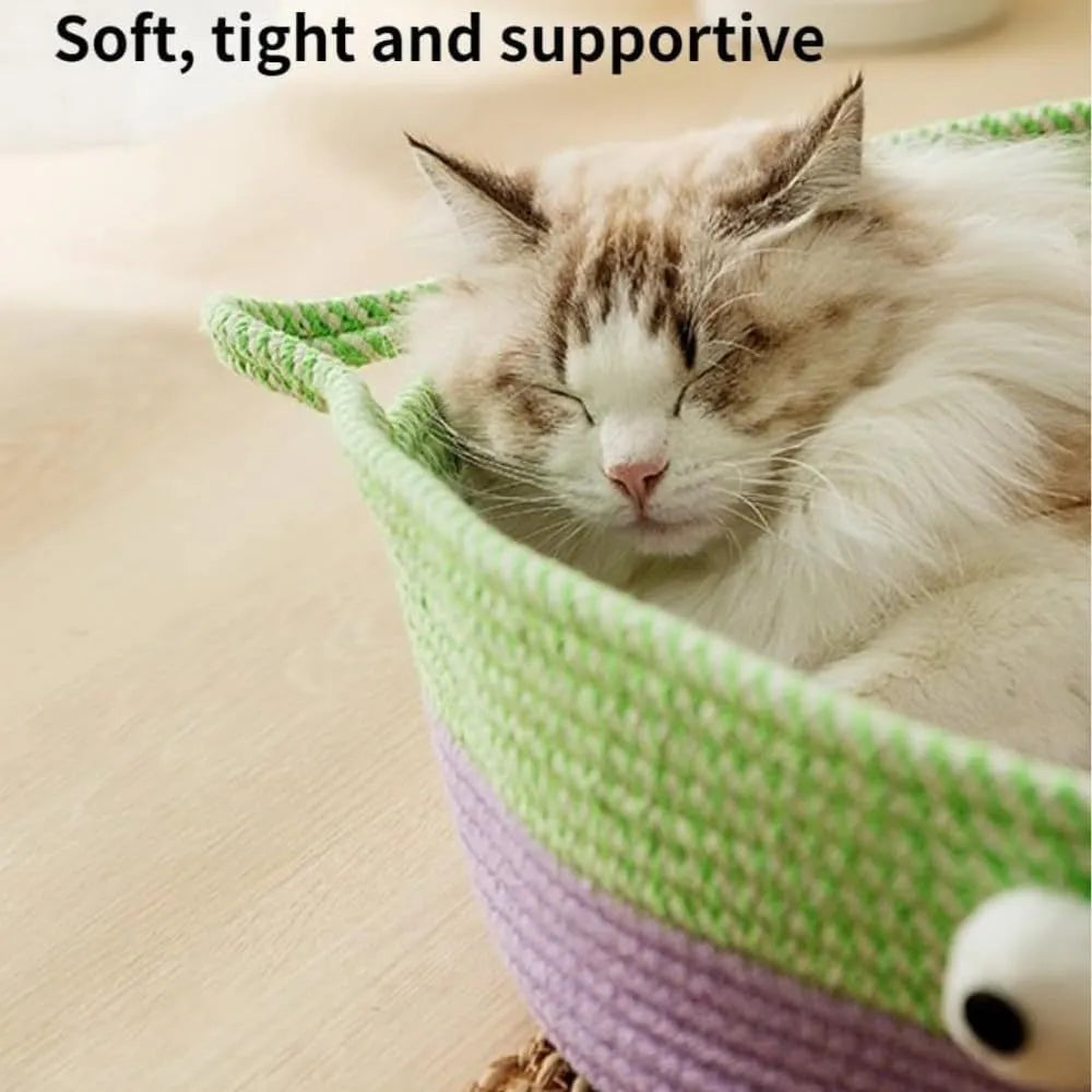 Round woven natural cotton rope cat bed in green with spiral edge, size M, on wooden floor