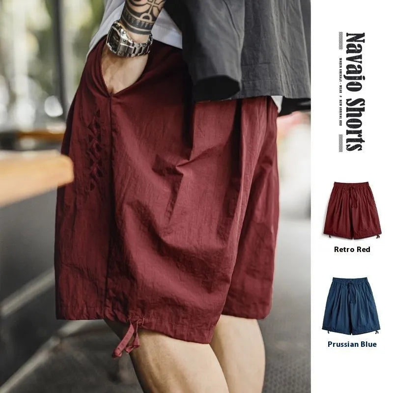 Men's loose fit embroidered shorts in Prussian blue colour with thin nylon fabric