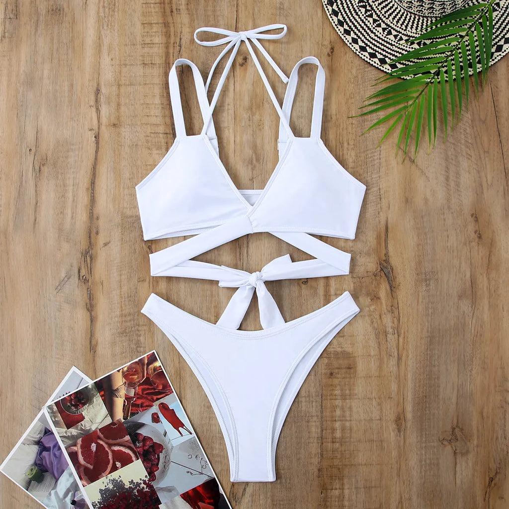 Solid colour strap bikini swimsuit for women in black, shown on a mannequin, sleeveless design with briefs.