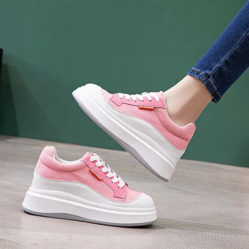 Women's thick-soled leather board shoes in pink and beige colours showing height-increasing design