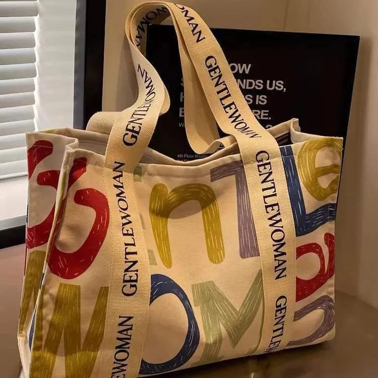 Canvas women's travel tote bag with printing elements and large capacity design