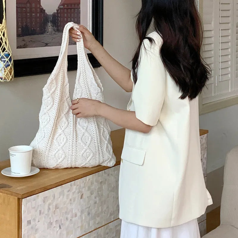 Women's retro style hollow knitted polyester tote bag in a solid colour, showing large open top and textured yarn material.