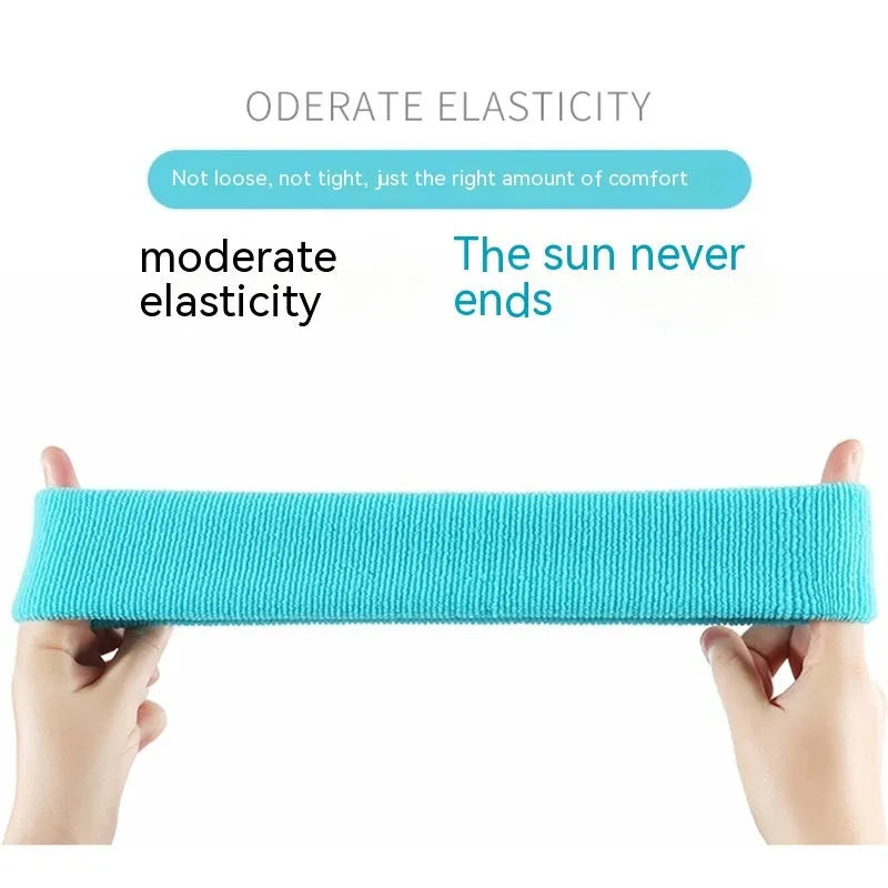Solid colour elastic sports sweat band in black, shown stretched, for running and gym use.