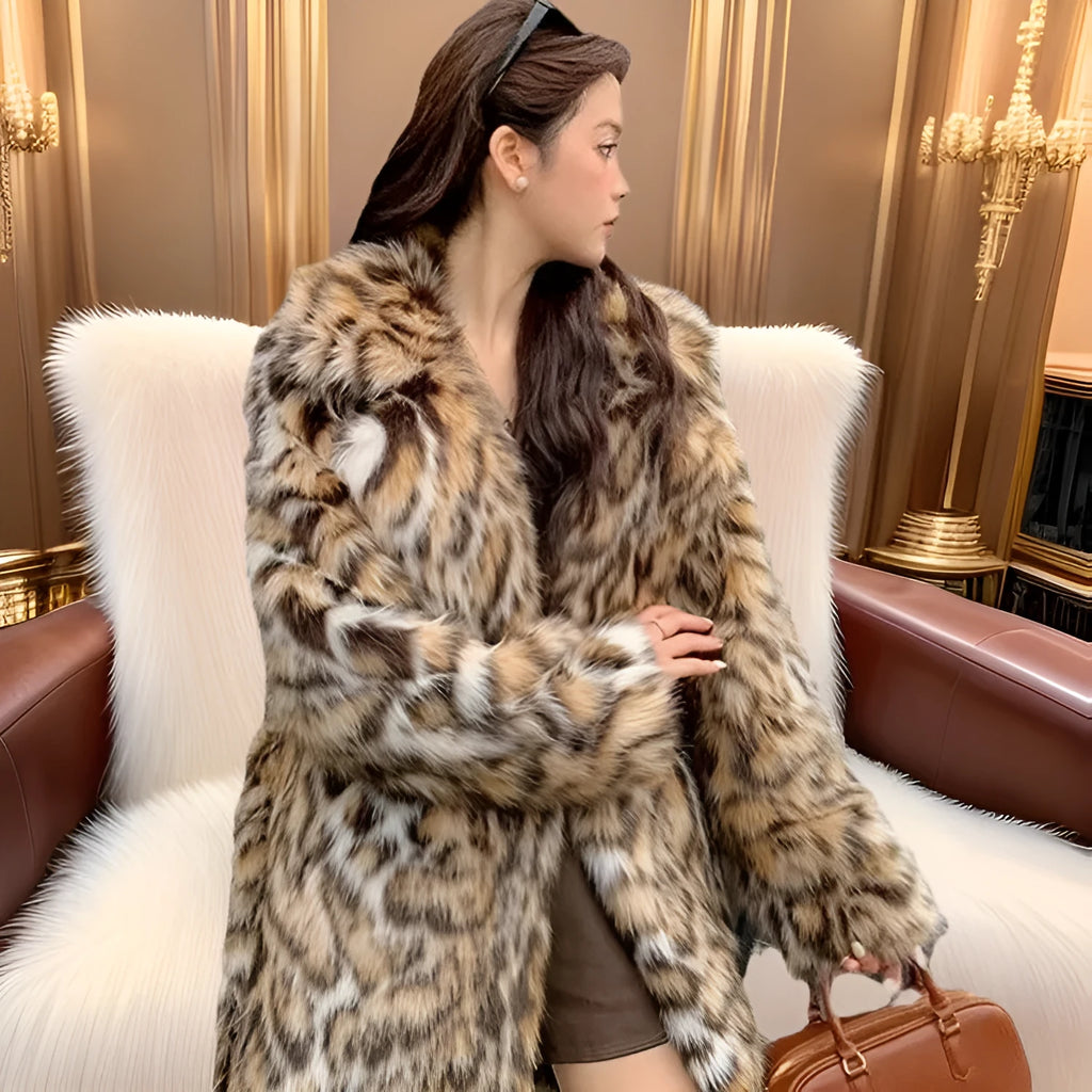 Women's grey faux fur mid-length winter coat with a fur collar and pockets on a model.