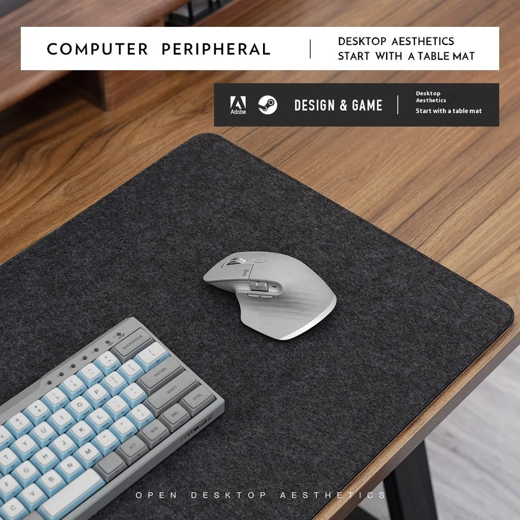 Japanese style simple desk mat in grey felt and cork, shown with keyboard and mouse.