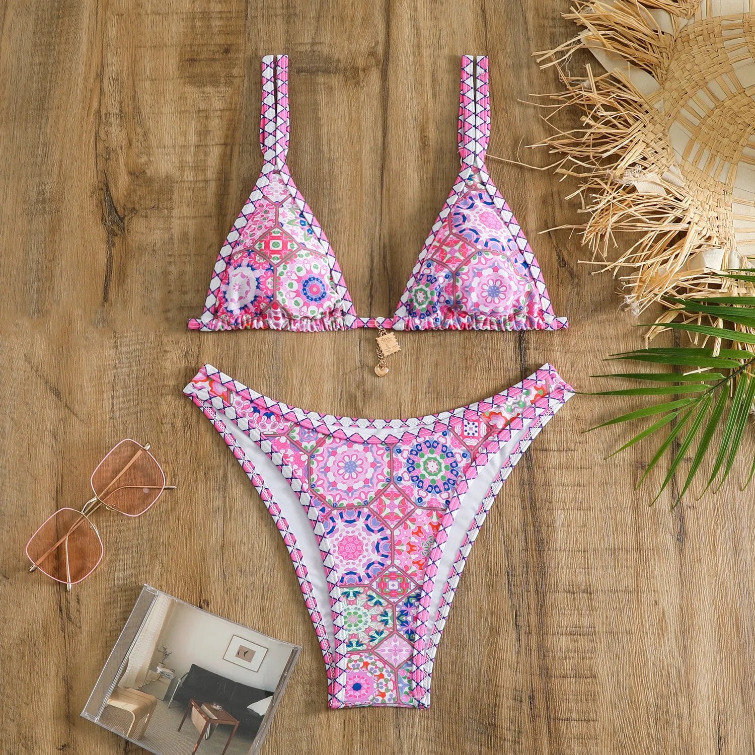 Retro four-colour print women's bikini swimwear in polyester fabric on a mannequin.