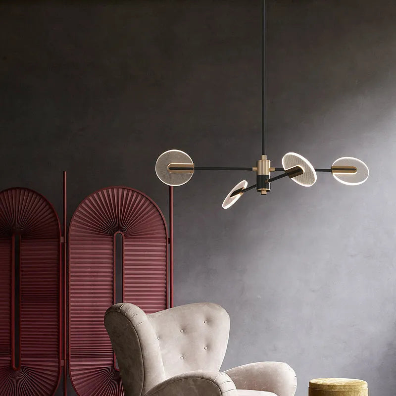 Nordic iron LED chandelier with acrylic elements hanging in a dining room setting