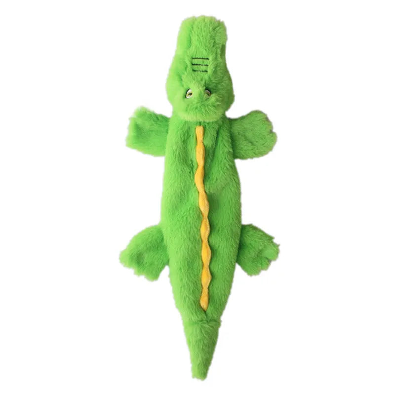 Green crocodile-shaped plush dog toy with no stuffing, squeaker in head and crinkle paper in tail