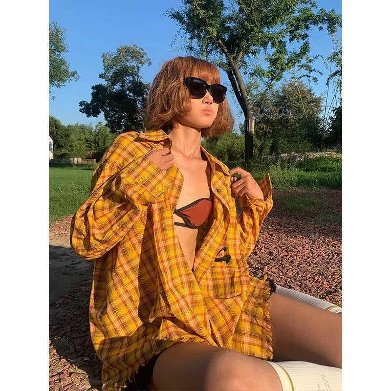 A loose-fitting dopamine yellow and black plaid cardigan-style shirt for men and women.