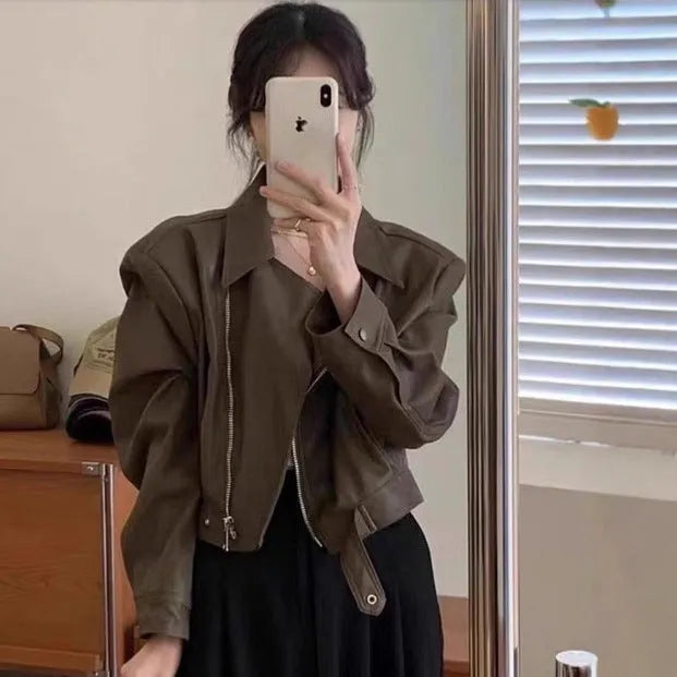 Women's brown retro imitation leather jacket with long sleeves, slim fit, and pockets.