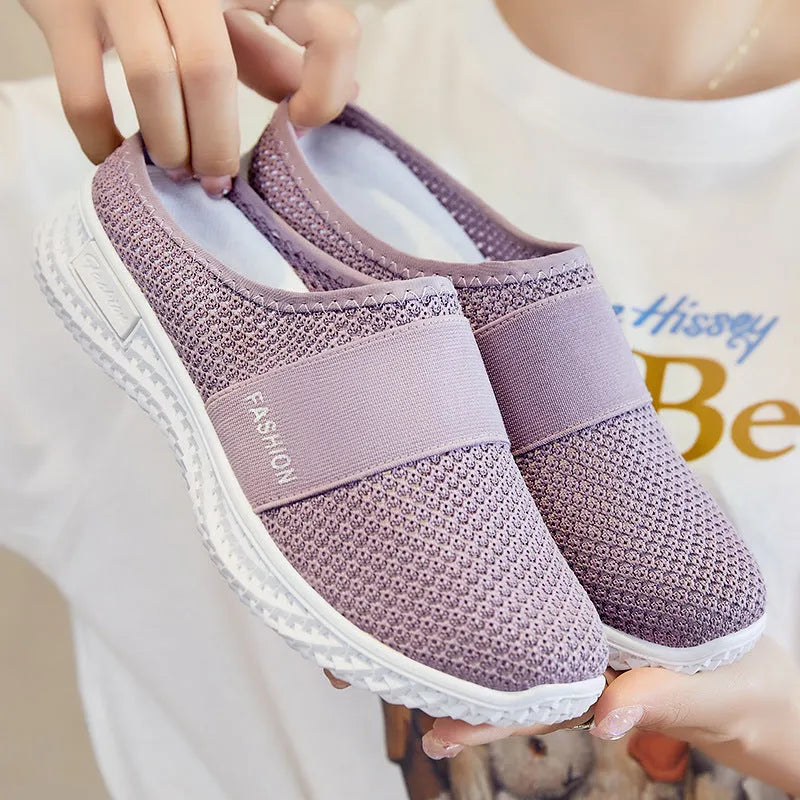 Women's breathable casual shoes with mesh upper and hollow-out design in black, flat heel.