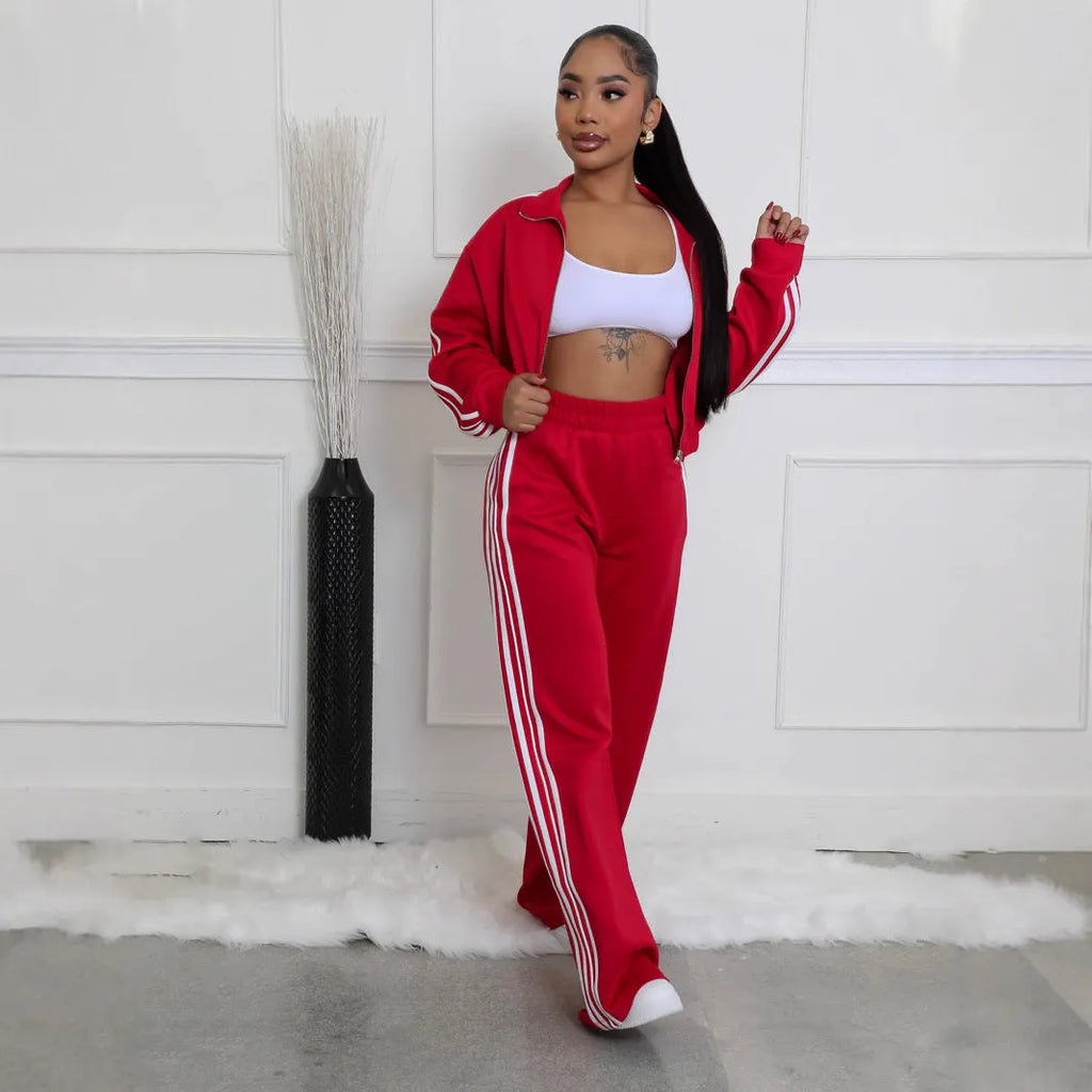Street hipster striped polyester two-piece set showing sweater and trousers in grey, black, red, pink, green, or blue colours