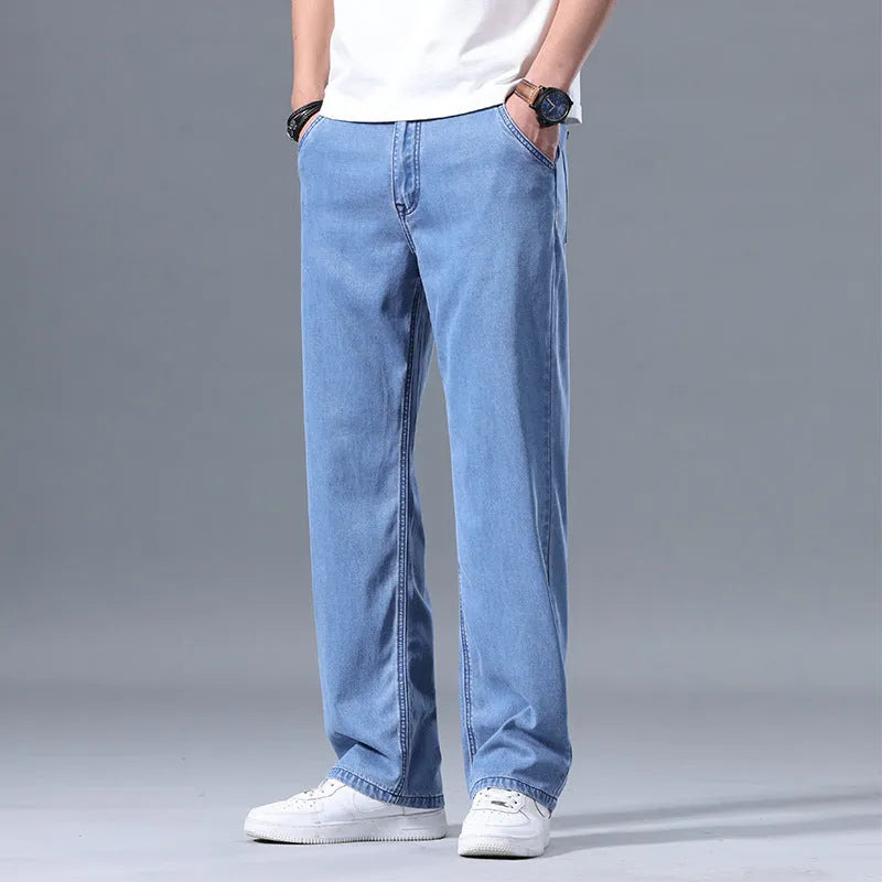 Men's loose straight leg lyocell jeans in light blue colour with zipper fly closure