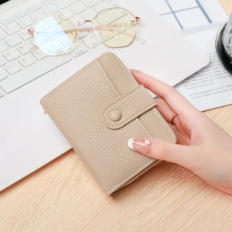 Ladies short wallet with lychee pattern in PU leather, two-fold design in beige colour