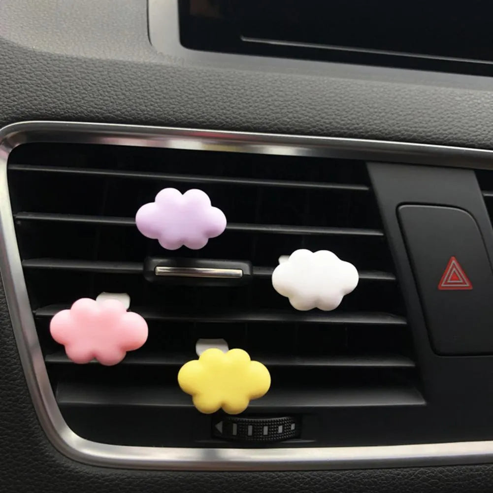 Resin Baiyun cartoon car fragrance clip in multiple colours attached to vehicle air vent measuring 17mm x 27mm