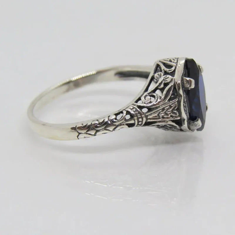 Silver women's ring with geometric hollow pattern and zircon stone on electroplated alloy