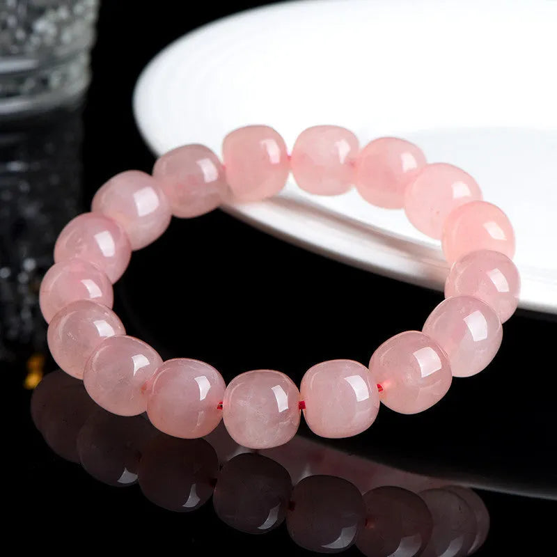 Pink crystal barrel bead bracelet with geometric design and 8 x 10mm beads