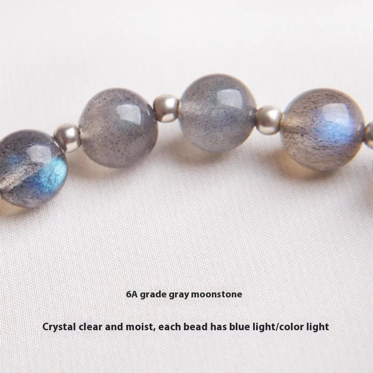 Women's silver bracelet with 7.5mm gray moonlight stone and zodiac design.