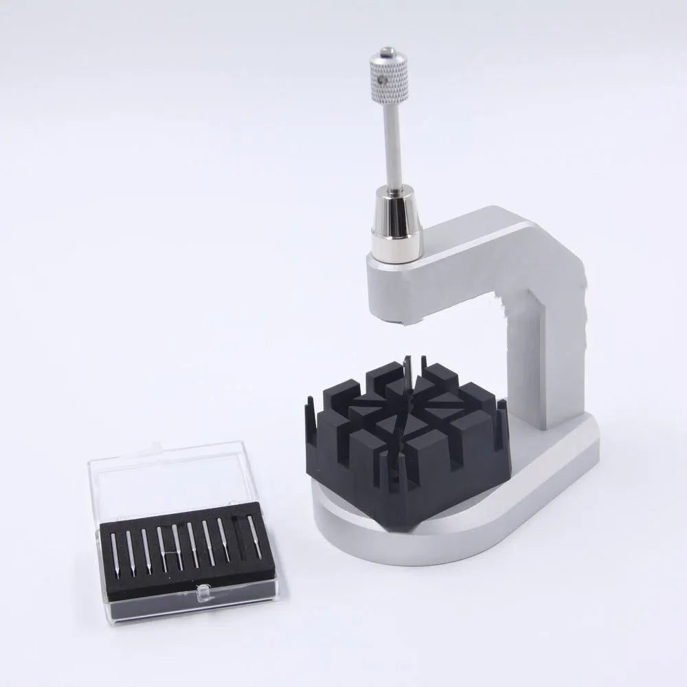 Silver tool steel multi-purpose press strap removal tool with 0.50-1.60mm blade on a workshop surface.