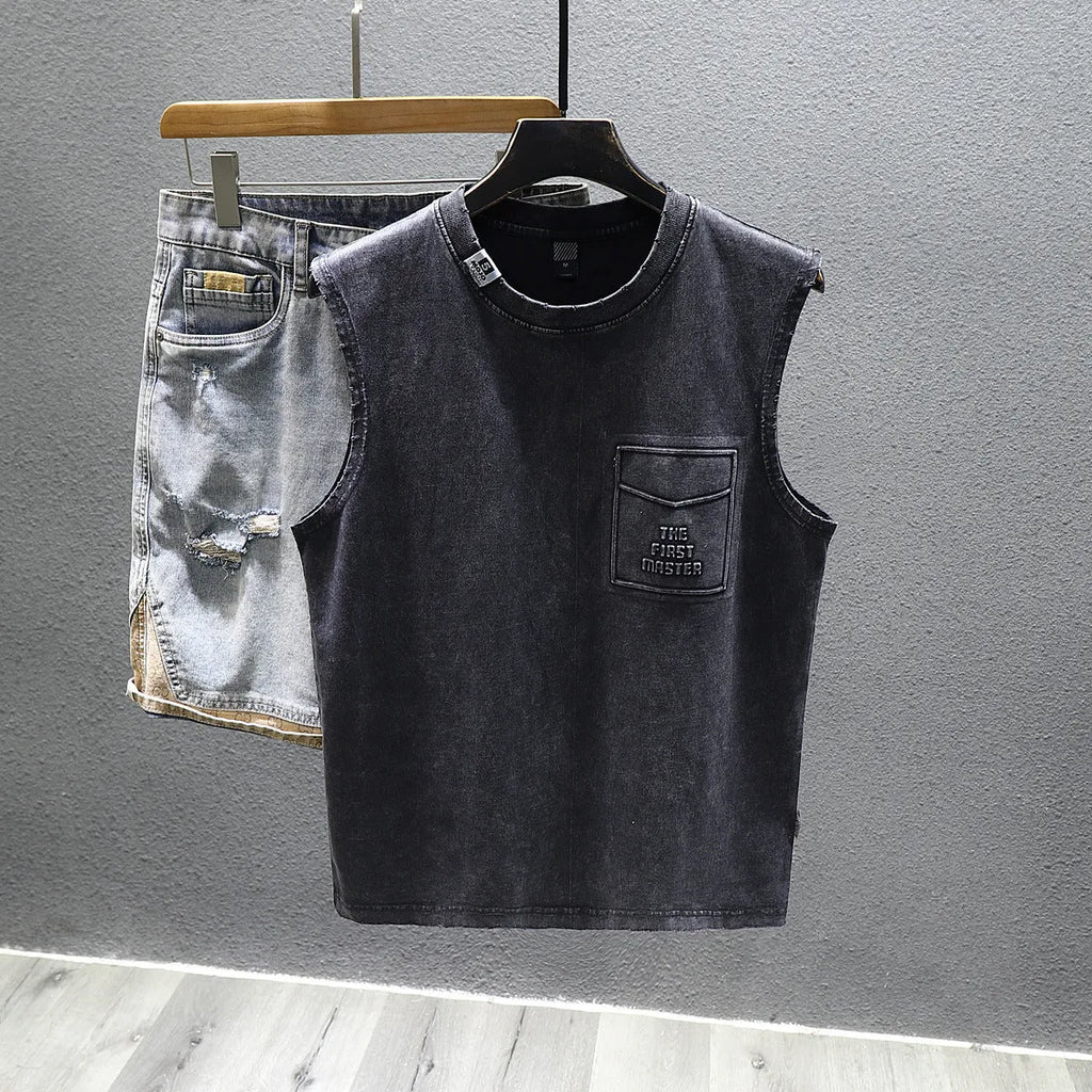 A man's solid colour loose-fit cotton sleeveless t-shirt with a straight hem.