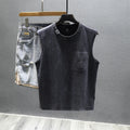 A man's solid colour loose-fit cotton sleeveless t-shirt with a straight hem.