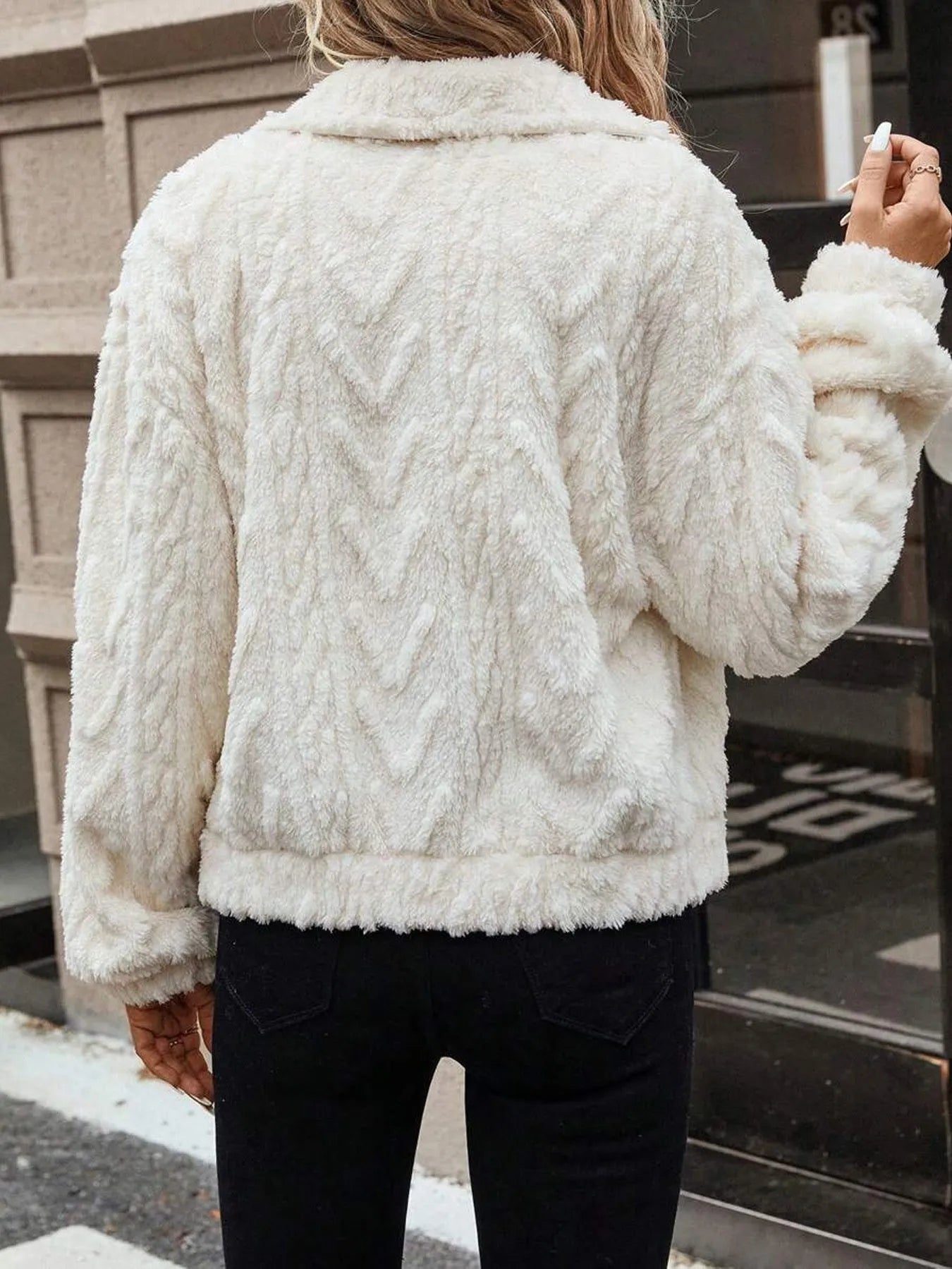 Ivory white women's plush button cardigan with regular sleeves on hanger