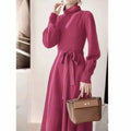 Turtleneck knit dress with elastic waist and loose hem in rose red colour