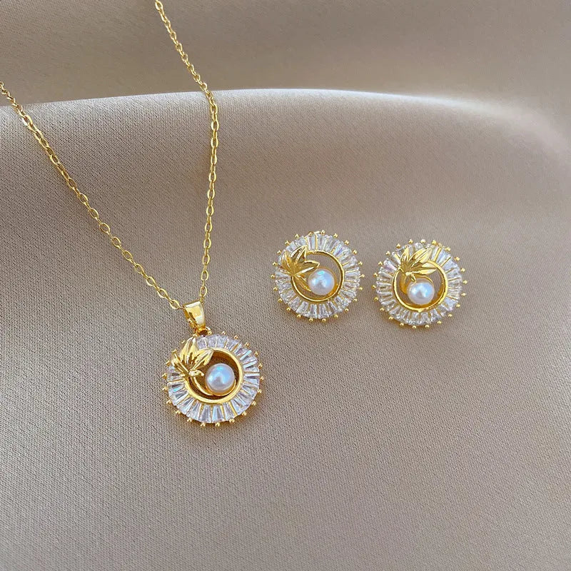 Women's titanium steel geometric jewellery set with round ring leaves necklace and matching electroplated earrings