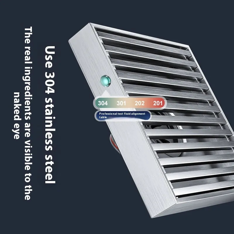 Gun grey 15cm square ABS plastic core sitting in a 304 stainless steel courtyard floor drain frame.