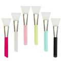 Reusable silicone spatula applicator for face and body masks in six colour options on a plain background.