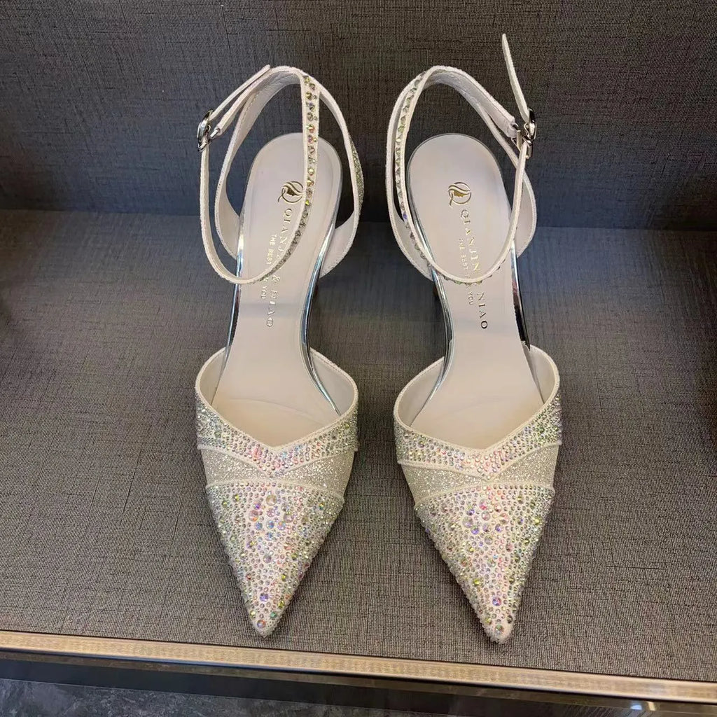 Women's silver and black hollow high heels with red sole and pointed stiletto heel